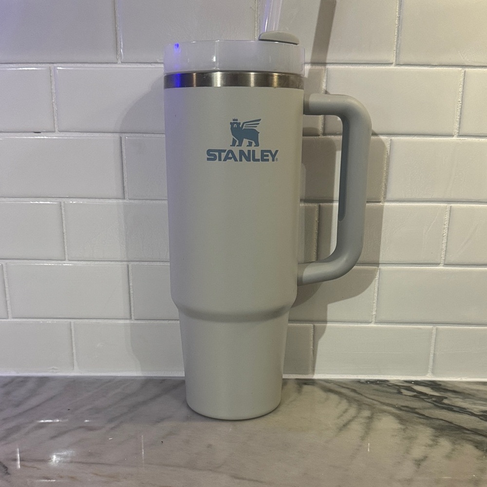 Stanley Light Gray Travel Tumbler with Blue Logo and Handle